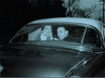 Bride and Groom in Car Waving Goodbye - 1950s