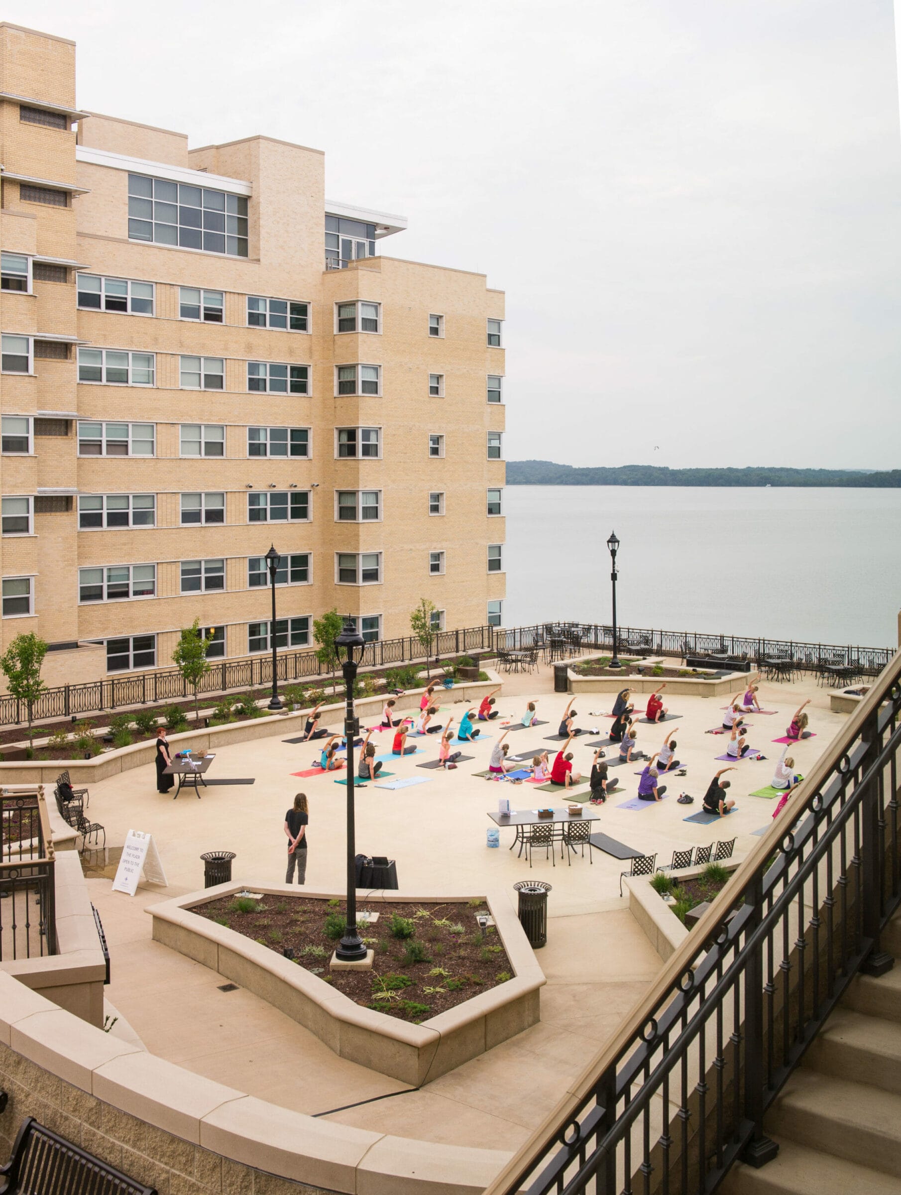 Group of People Doing Yoga on The Edgewater Grand Plaza
