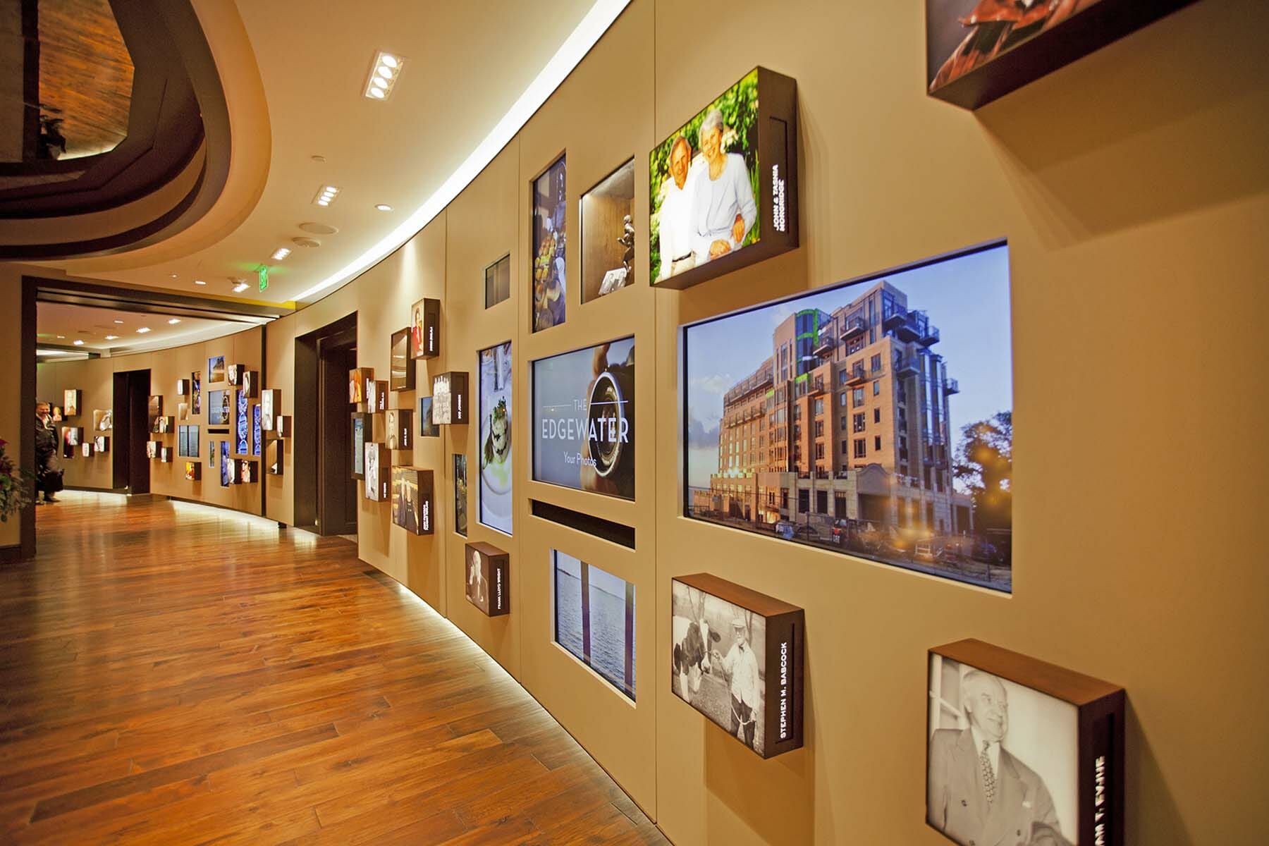 View of hallway with historical images and video of The Edgewater