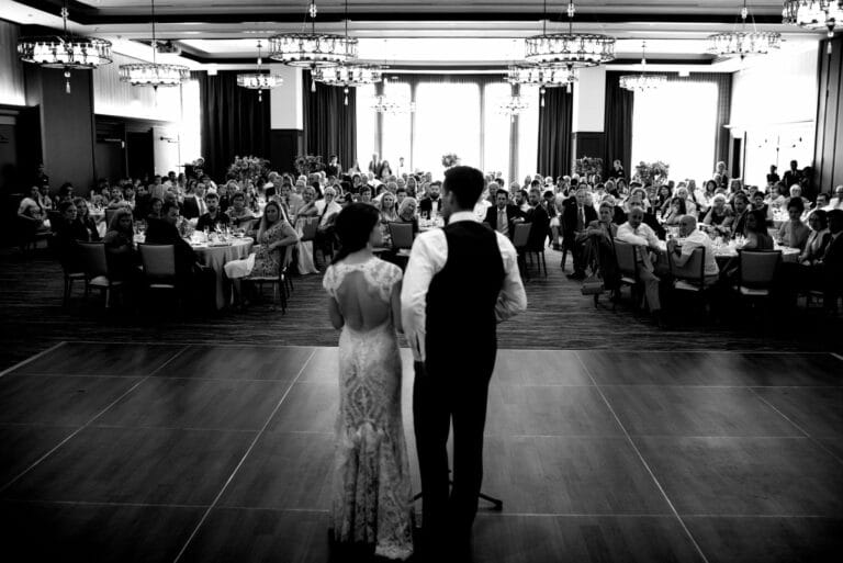Black and White Image of Bride and Groom at Wedding Reception