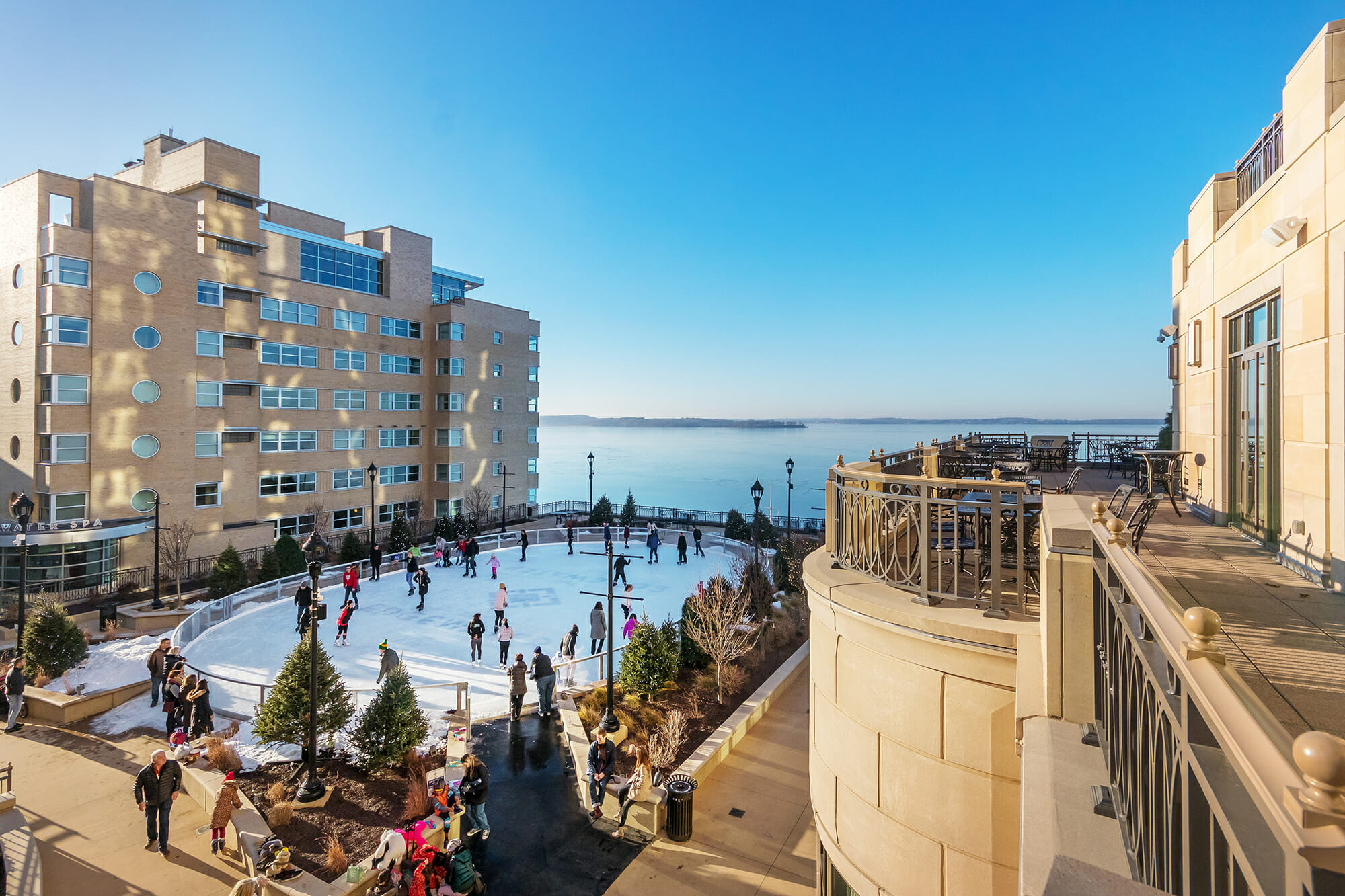 People Skating on The Ice Rink at The Edgewater on a Sunny Day
